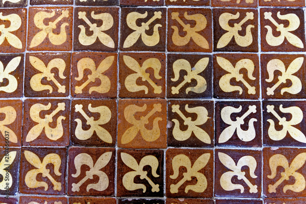 Medieval painted stone floor tiles inside Winchester Cathedral, Hampshire, England