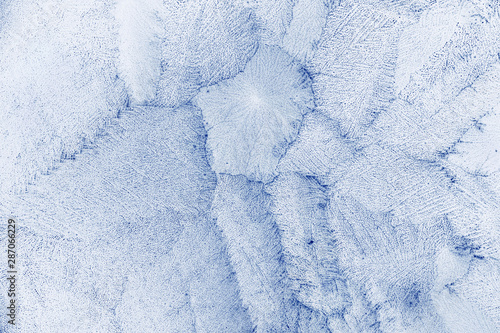 Frost texture.  Icy crystals frozen surface. Blue winter Christmas abstract background