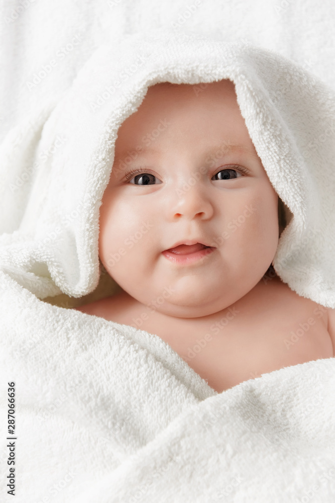 Smiling baby in a towel Smiling baby in a towel