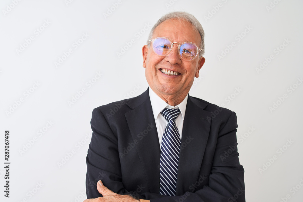 Senior grey-haired businessman wearing suit and glasses over isolated white background happy face smiling with crossed arms looking at the camera. Positive person. Senior grey-haired businessman wearing suit and glasses over isolated white background happy face smiling with crossed arms looking at the camera. Positive person.