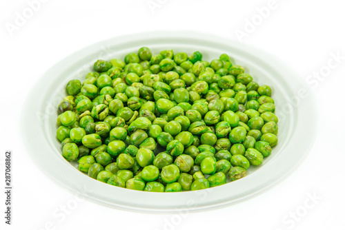 Sugar pea grains in natural pulp dish isolated on white background