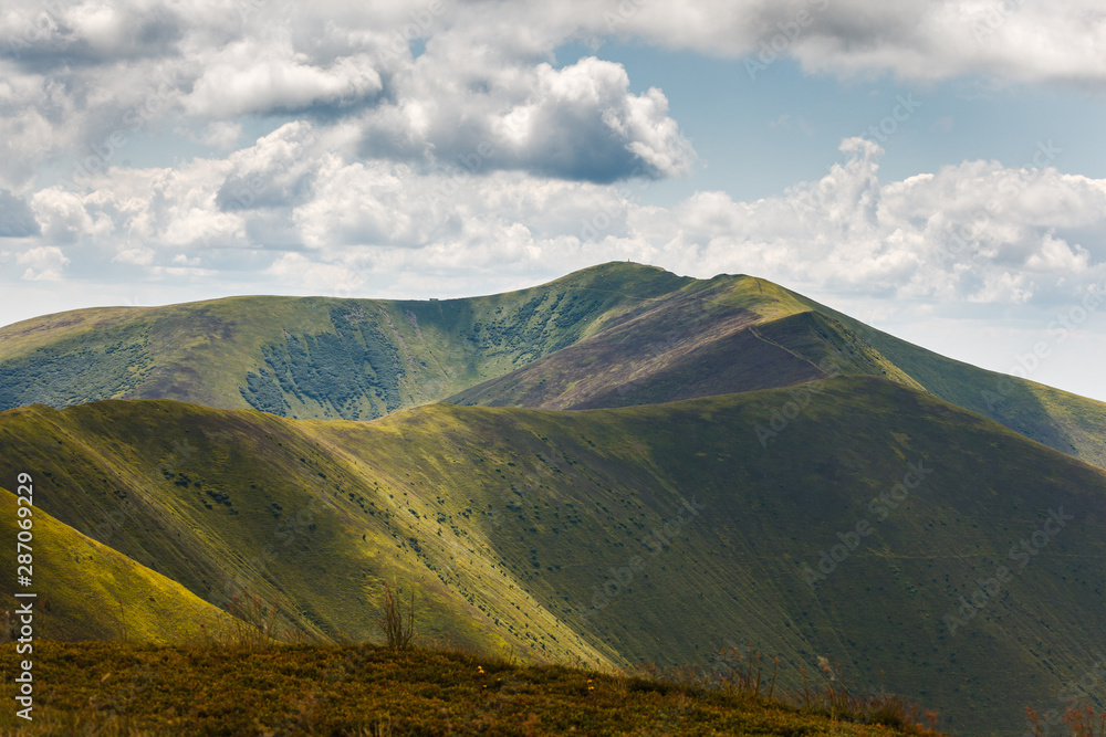 Landscape of Borzhava ridge of the Ukrainian Carpathian Mountains. Clouds above rock.