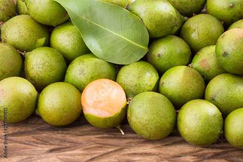 Melicoccus bijugatus - Fresh ripe peeled quenepa fruit photo