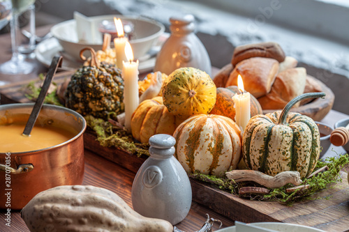 Autumn table setting with pumpkins. Thanksgiving holiday dinner and fall decoration.