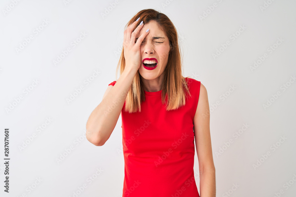 Redhead businesswoman wearing elegant red dress standing over isolated white background Yawning tired covering half face, eye and mouth with hand. Face hurts in pain. Redhead businesswoman wearing elegant red dress standing over isolated white background Yawning tired covering half face, eye and mouth with hand. Face hurts in pain.