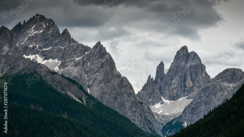Timelapse of Cima Dodici or Zwölferkofel dolomitic group in the Sexten Dolomites, South Tyrol. Italy. Tilt camera movement. photo
