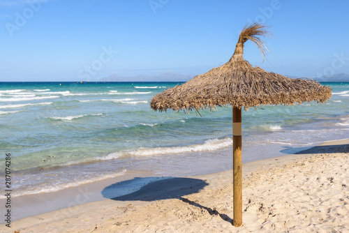 Umbrella at the Playa de Muro beach in Mallorca, Spain © vivoo