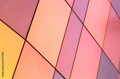 Bright yellow and pink, purple, salmon, plum color multicolored tile of different size for interior and exterior design, diagonal view.