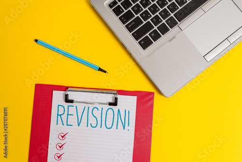 Writing note showing Revision. Business concept for action of revising over someone like auditing or accounting Trendy metallic laptop clipboard paper sheet marker colored background photo