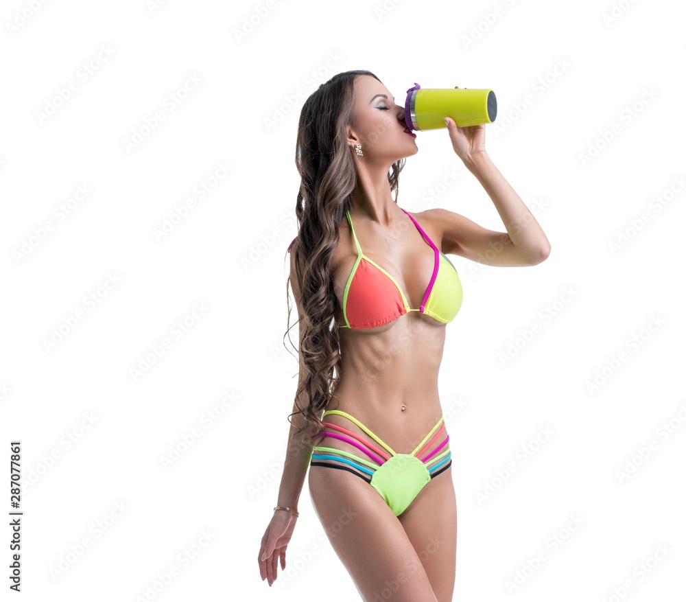 Sexy model in bright bikini drinks protein shake Stock Photo | Adobe Stock