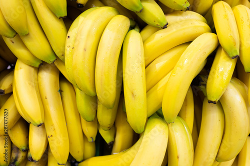Whole bundle of yellow ripe bananas rich in vitamin c, for food background