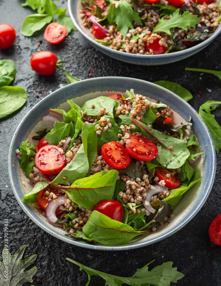 Buckwheat salad with cherry tomatoes, red onion and green vegetables. Healthy diet food Buckwheat salad with cherry tomatoes, red onion and green vegetables. Healthy diet food