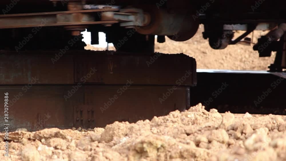 The swivel mechanism of a walking dragline excavator rotates. Closeup