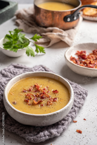 Lentil pea soup garnish with bacon and pork ribs