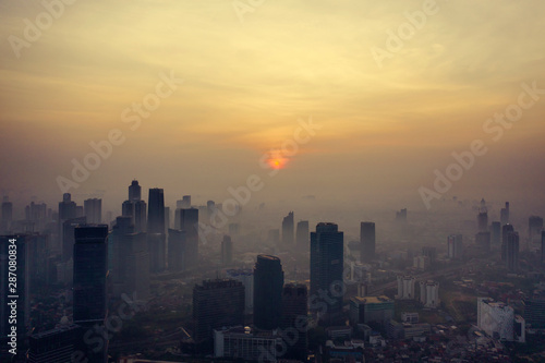 Foggy skyscrapers and residential at dawning © Creativa Images