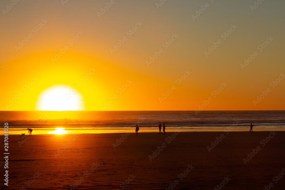 sunset at Piha beach, North Island, New Zealand