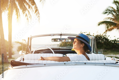 Photography Happy young woman and retro convertible car