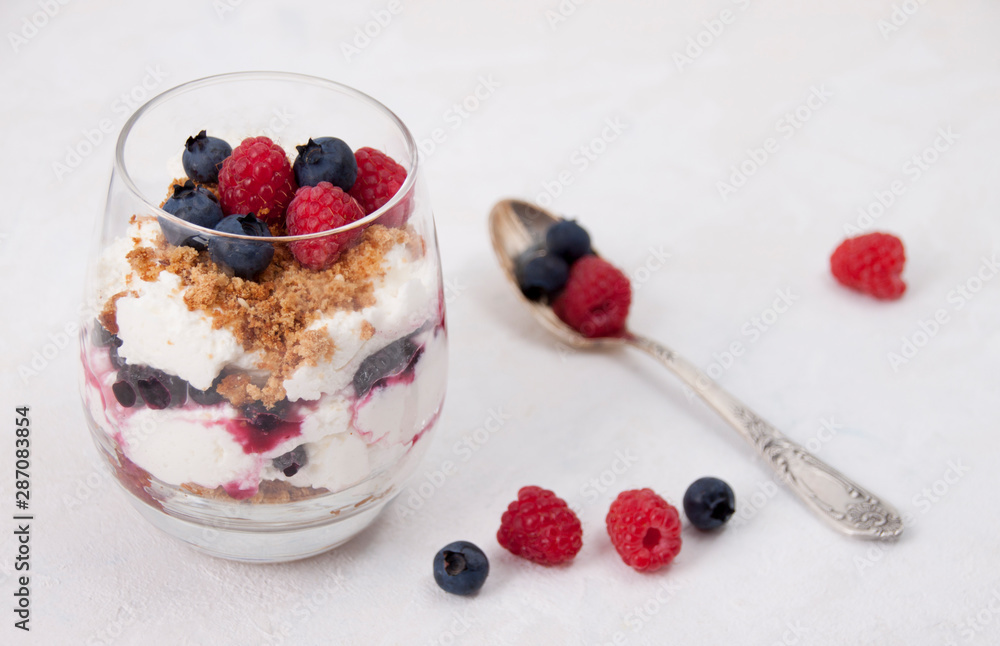 Curd dessert with raspberries, blueberries and cookies Curd dessert with raspberries, blueberries and cookies