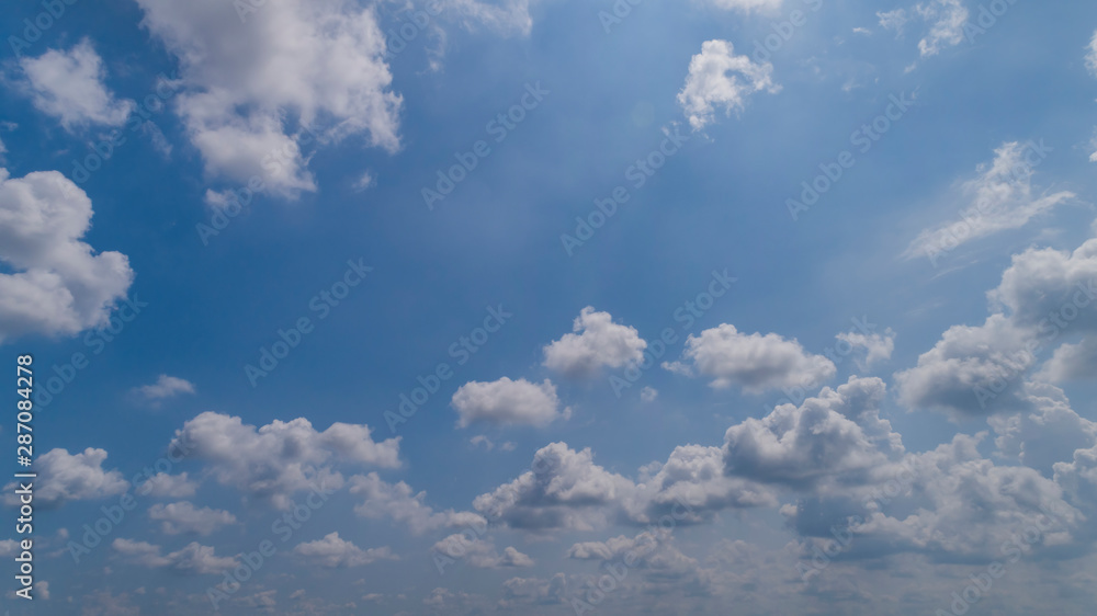 White and Dark Clouds Floating in the Bright Blue Skies White and Dark Clouds Floating in the Bright Blue Skies