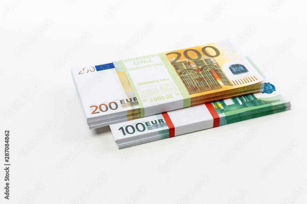 Euro cash in bundles of one hundred and two hundred banknotes, Euro money Euro on a white background, isolated on a white background Euro cash in bundles of one hundred and two hundred banknotes, Euro money Euro on a white background, isolated on a white background