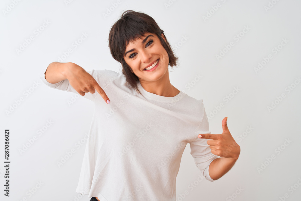 Young beautiful woman wearing casual t-shirt standing over isolated white background looking confident with smile on face, pointing oneself with fingers proud and happy. Young beautiful woman wearing casual t-shirt standing over isolated white background looking confident with smile on face, pointing oneself with fingers proud and happy.
