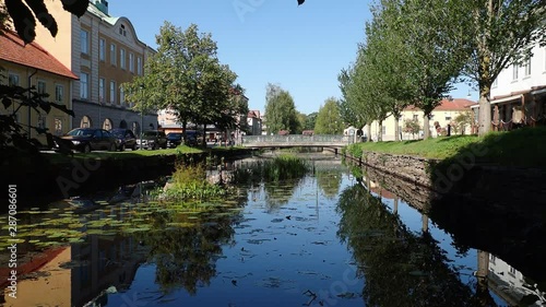 Establishing shot of the bridge over lillan connecting lilla torget and stora torget in alingsas sweden photo