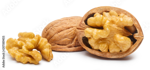 Delicious whole and broken walnuts, isolated on white background