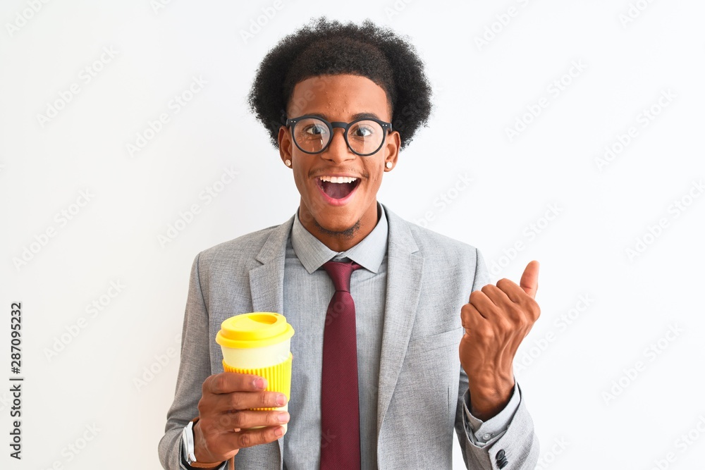 African american businessman drinking cup of coffee over isolated white background screaming proud and celebrating victory and success very excited, cheering emotion African american businessman drinking cup of coffee over isolated white background screaming proud and celebrating victory and success very excited, cheering emotion