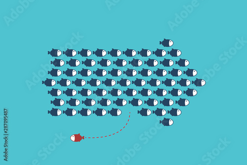 Think differently -One red unique different fish swimming opposite way of identical blue ones.	
