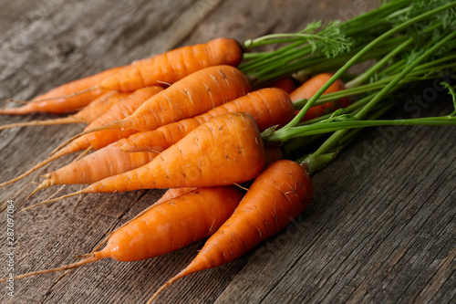 Fresh carrots with greens close up