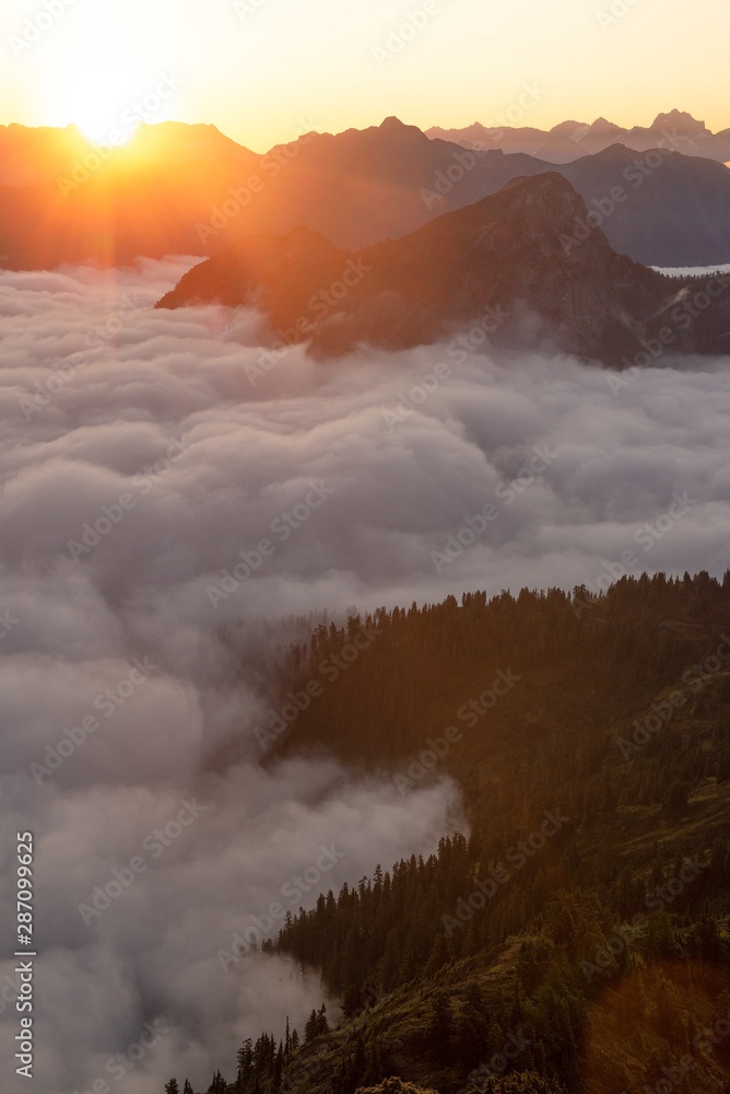 Mountain layers above fog at first light 