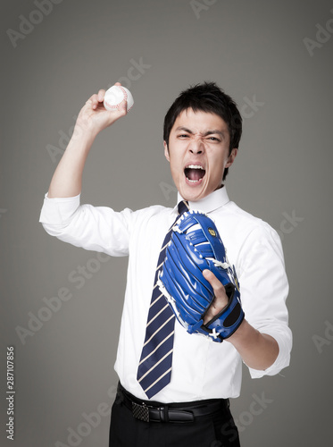 Photography businessman wearing a baseball glove.