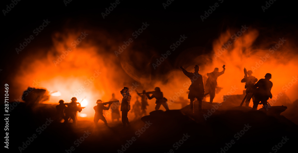 Fototapeta premium War Concept. Military silhouettes fighting scene on war fog sky background,