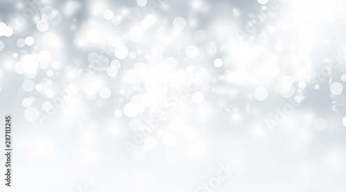 white and gray snow blur abstract background. Grey Bokeh Christmas blurred beautiful shiny Christmas lights
