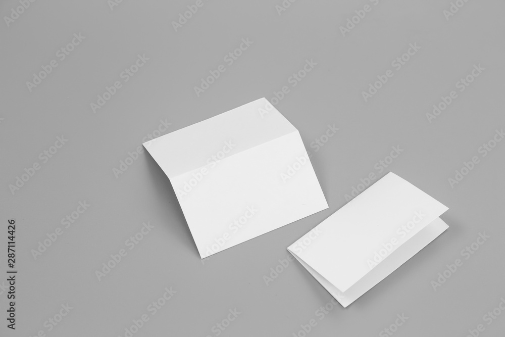 Blank portrait mock-up paper. brochure magazine isolated on gray, changeable background / white paper isolated on gray Blank portrait mock-up paper. brochure magazine isolated on gray, changeable background / white paper isolated on gray
