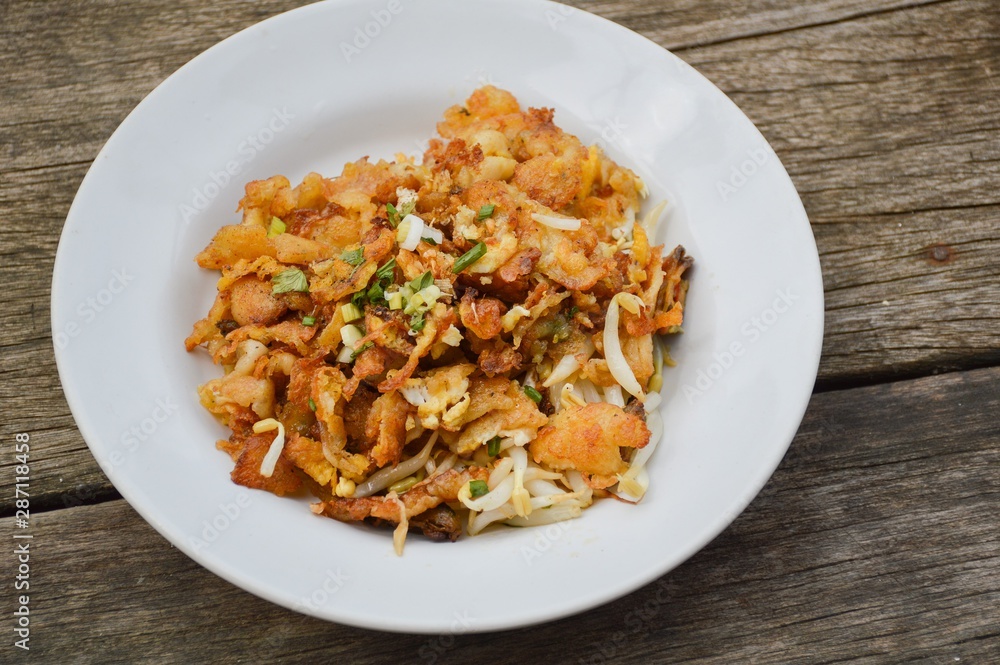 Crisp fried mussel pancakes on white dish