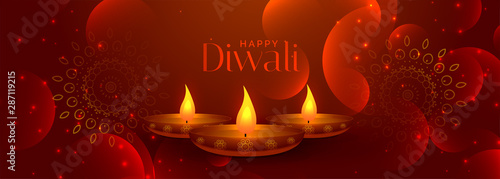 lovely happy diwali banner with three diya lamps