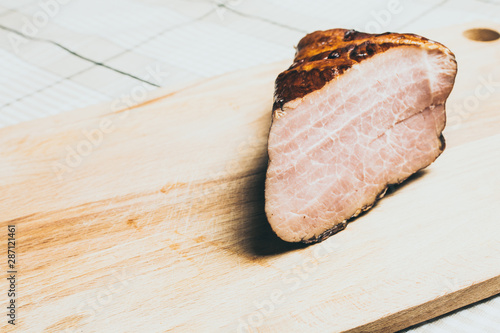 Wallpaper Mural Large piece of smoked boar meat on wooden cutting board. Torontodigital.ca