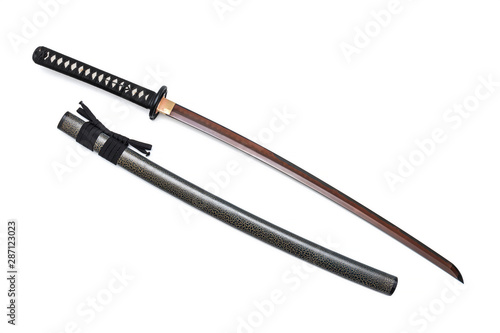 Red blade Japanese sword black cord with full textured scabbard isolated in white background.