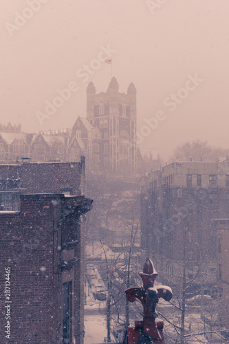 Dreamy scenery during a massive winterstorm with heavy snowfall in Harlem, New York, USA