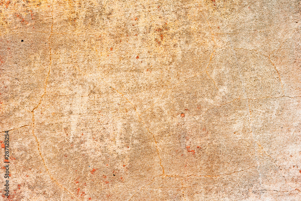 Texture of a concrete wall with cracks and scratches which can be used as a background Texture of a concrete wall with cracks and scratches which can be used as a background