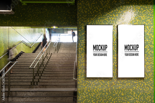 Obraz na płótnie Blank billboard located in underground hall or subway for advertising, mockup concept, Low light speed shutter w salonie