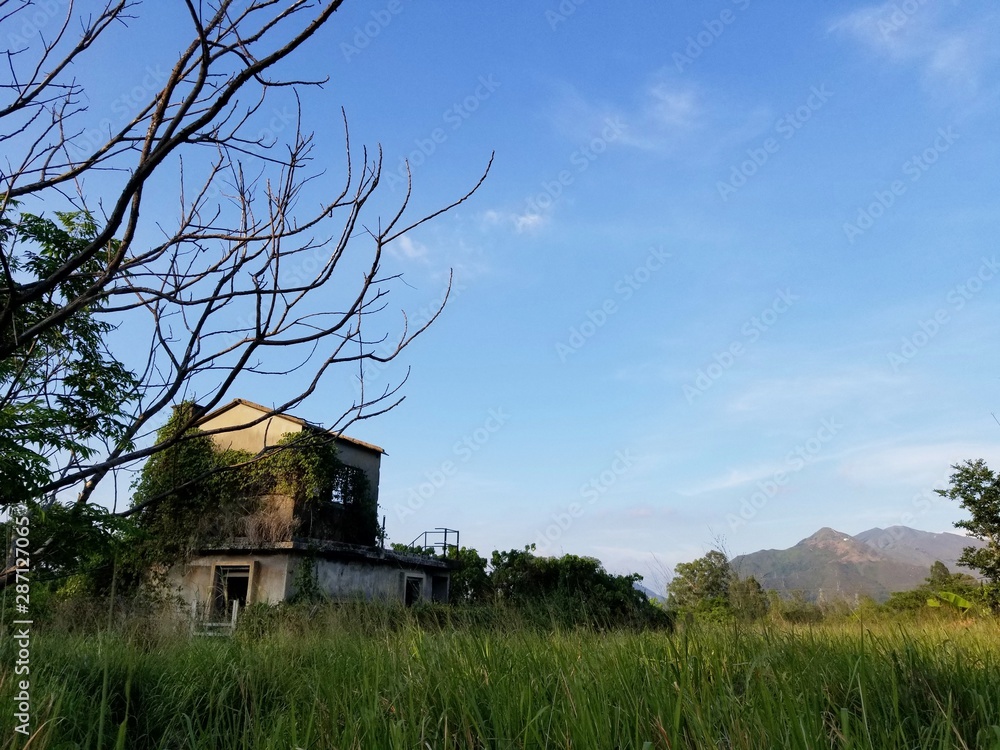 A deserted and dilapidated two-storey hut, Nam Sang Wai, Yuen Long, Hong Kong A deserted and dilapidated two-storey hut, Nam Sang Wai, Yuen Long, Hong Kong