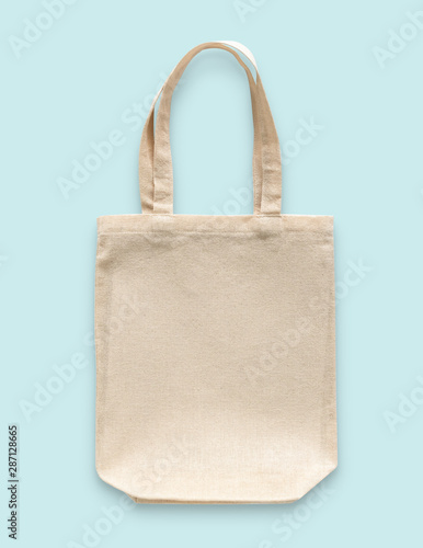 Tote bag canvas cotton fabric cloth for eco shopping sack mockup blank template isolated on blue background (clipping path)