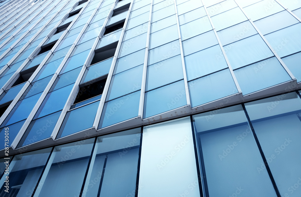 Close-Up modern office building.building with copy space.windows office building for background Close-Up modern office building.building with copy space.windows office building for background