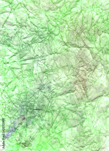 Green crumpled paper. Wrinkled background. Color abstract wallpaper. Colorful craft page.