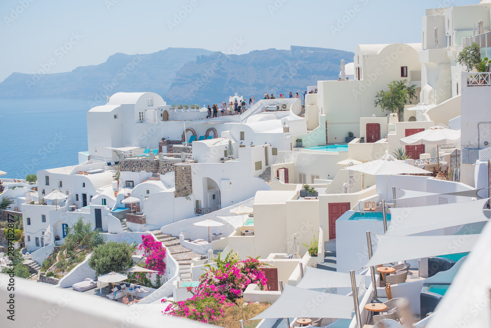 Santorini, Greece August 27 Illustrative editorial :  Picturesque view of traditional Santorini streets. Location: Oia village, Santorini, Greece. Vacations background. 