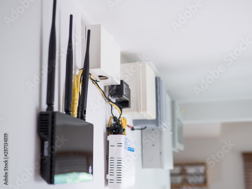 Close up of wireless router on the wall.