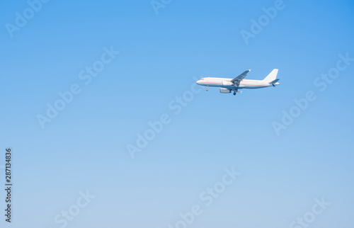 Simple photo Airplane in blue sky, travels concept