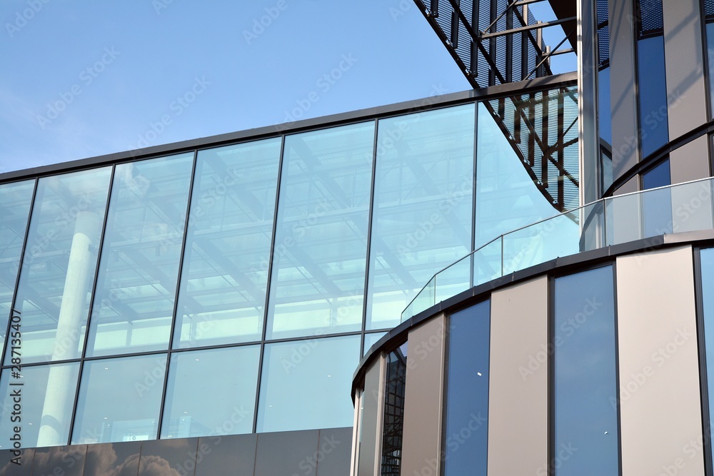 Facade fragment of a modern office building. Exterior of glass wall with abstract texture. Facade fragment of a modern office building. Exterior of glass wall with abstract texture.